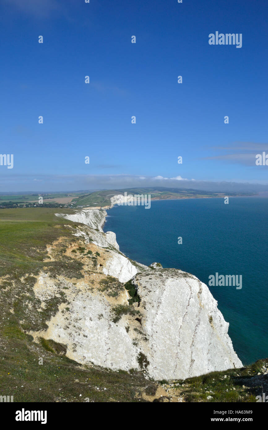 The white chalk cliffs of Tennyson Down on the Isle of Wight looking across Freswater Bay Stock Photo