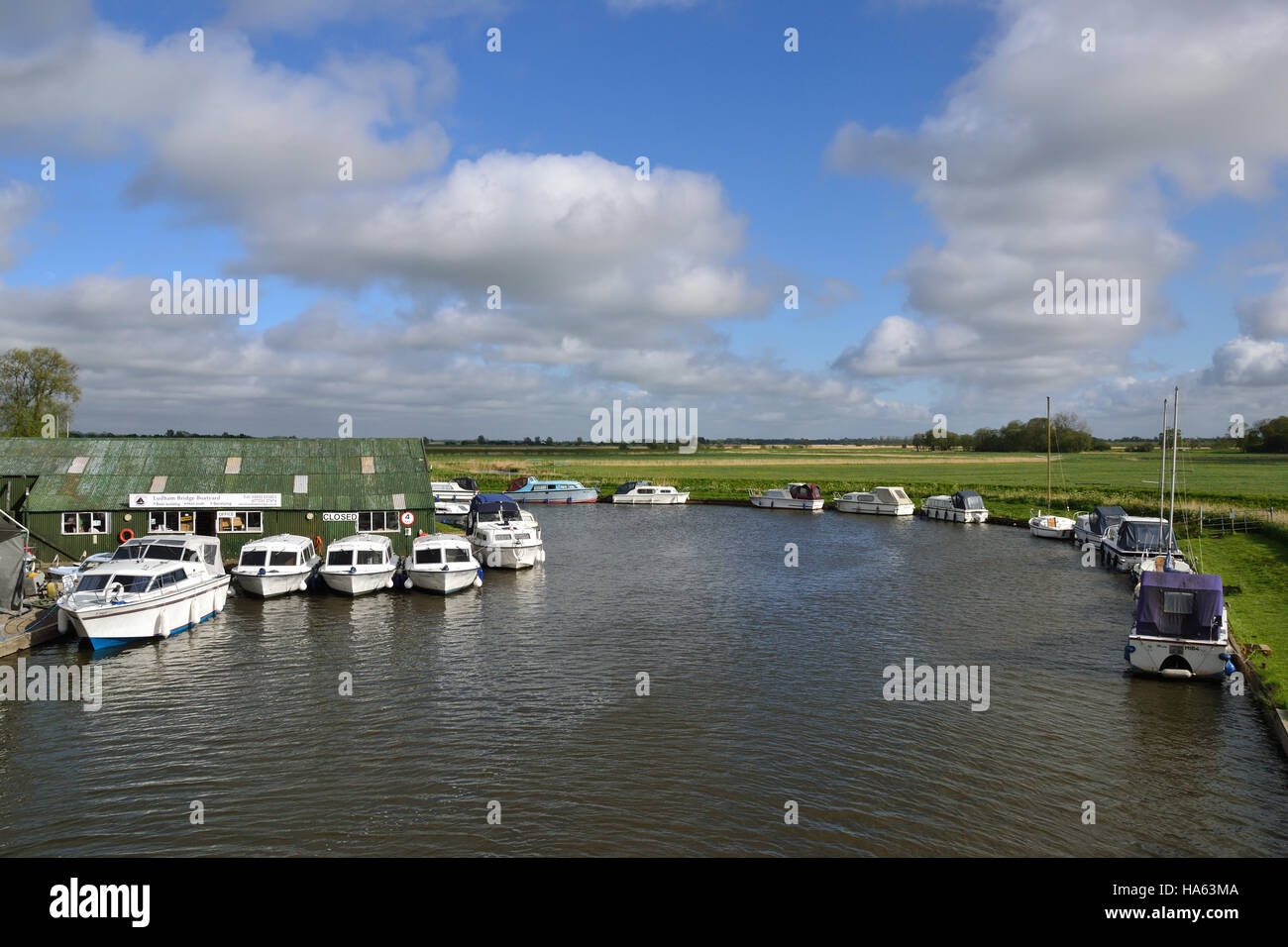 Boats moored at Ludham Bridge Boatyard on the River Ant on the Norfolk Broads. Stock Photo