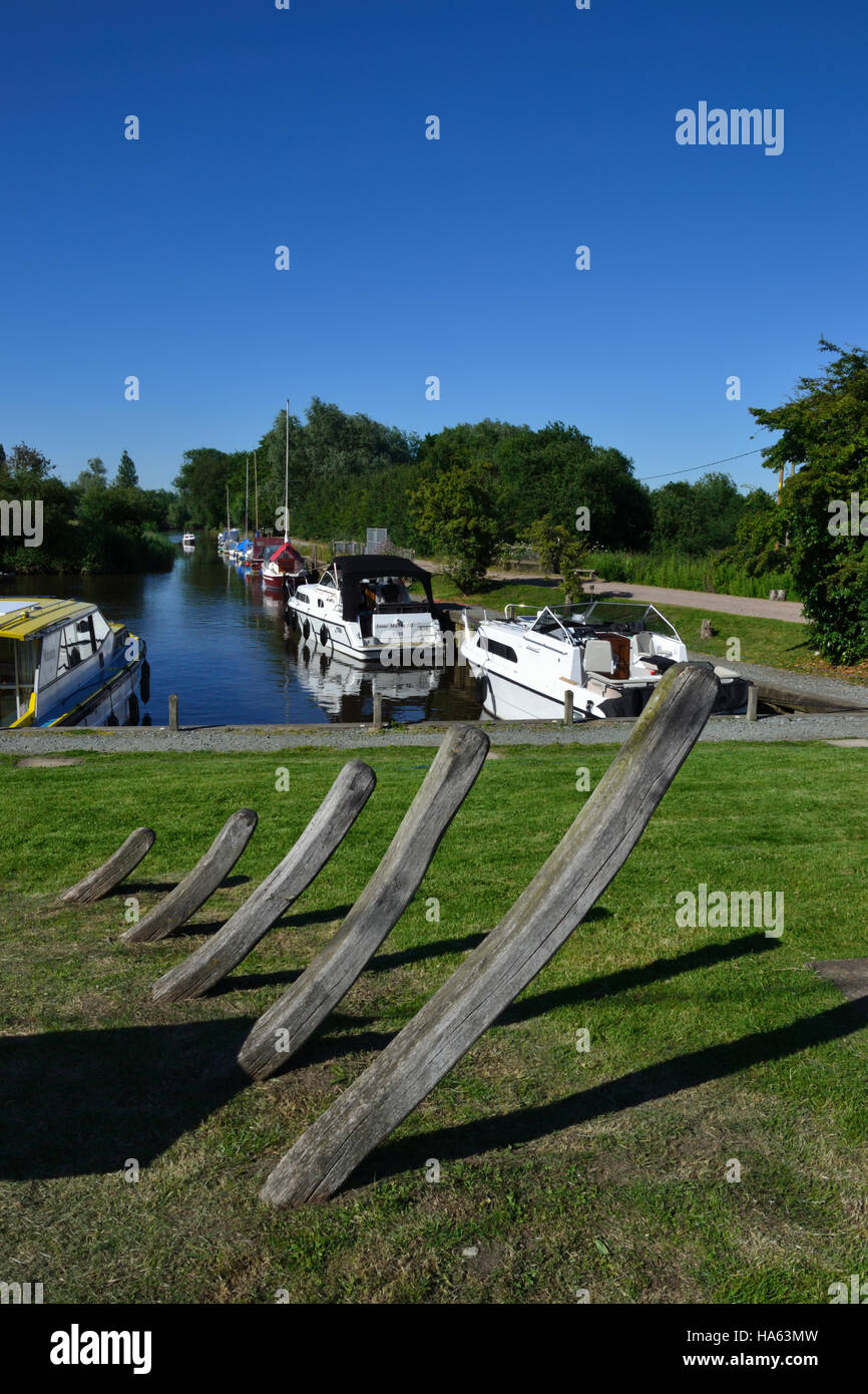 Rockland Staithe situated off the River Yare on the Norfolk Broads. In the foreground the bones of an old wherry. Stock Photo