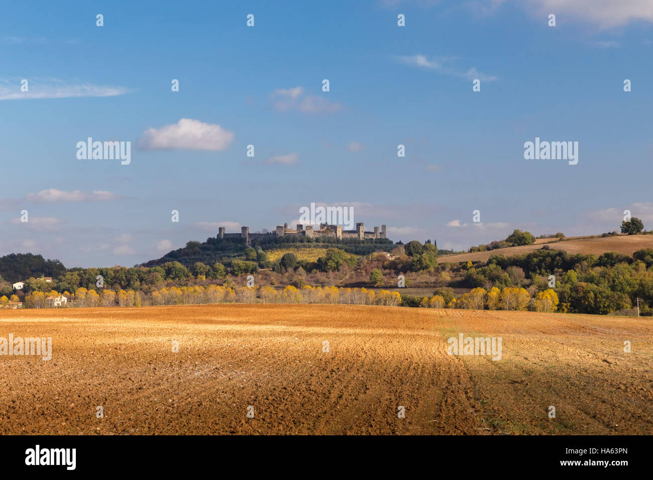 View of rocks and fields near Podere Belvedere, San Quirico d'Orcia, Val d'Orcia, Tuscany, Italy. Stock Photo