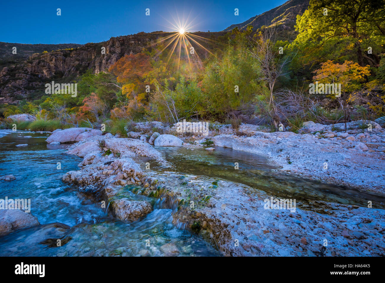 McKittrick Canyon is a scenic canyon within the Guadalupe Mountains of West Texas and Eddy County, New Mexico. The steep towering walls of McKittrick  Stock Photo