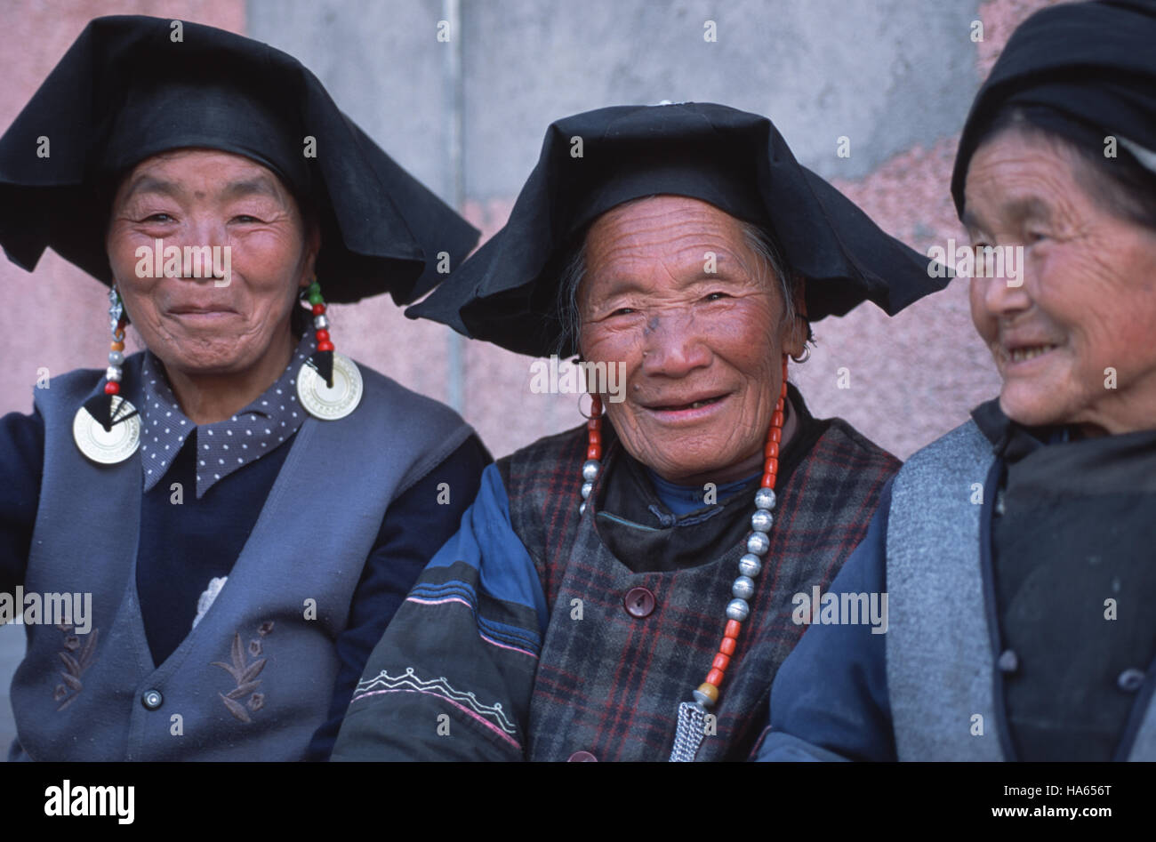 Caption: Kangding, Sichuan, China - Aug 2002. Khampa women from a small valley bordering the plains of Sichuan.  Sedentary and largely believing in Bo Stock Photo