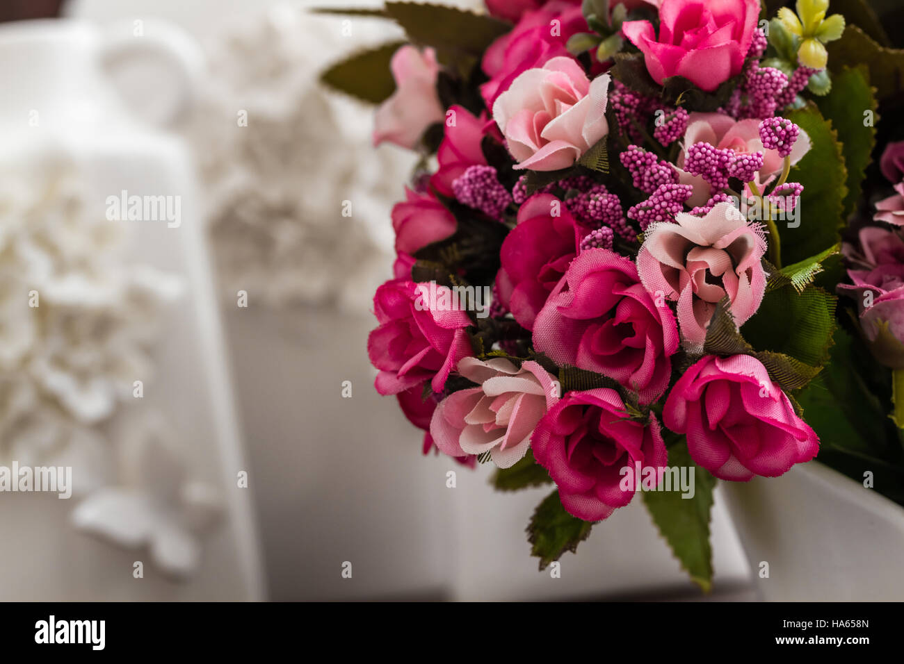 Different decorative white vases with 3d flower and butterfly designs Stock Photo