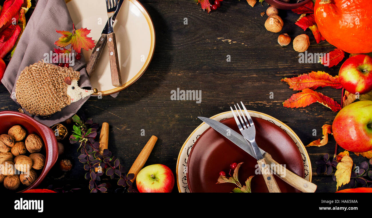 Autumn table setting with fruits and nuts. Top view Stock Photo