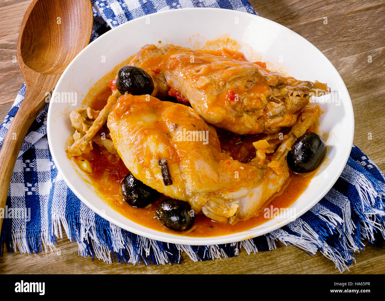 Stewed rabbit legs with olives. View from above Stock Photo - Alamy