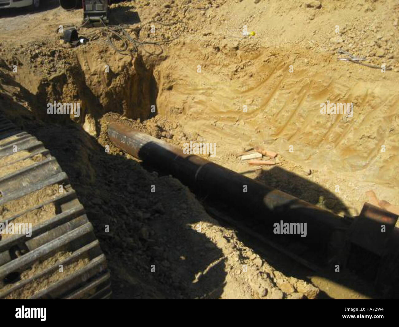 A water line installation project in Newburg, West Virginia, where a drilling machine is boring a hole under a road for the installation of a new water line. Stock Photo