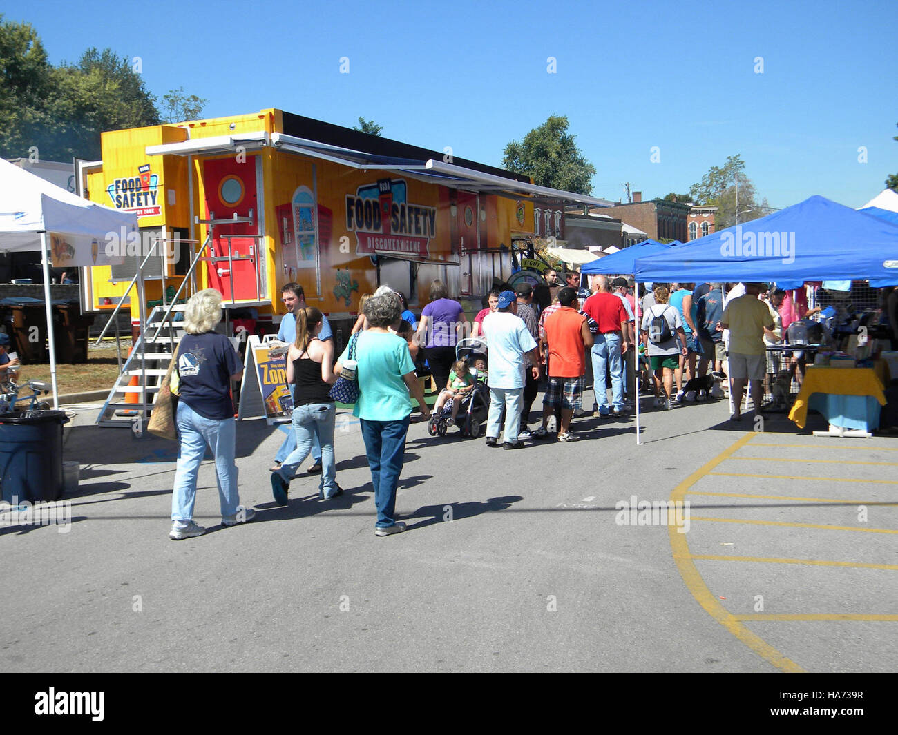 The image shows the FSIS Food Safety booth at the Midway Fall Festival ...