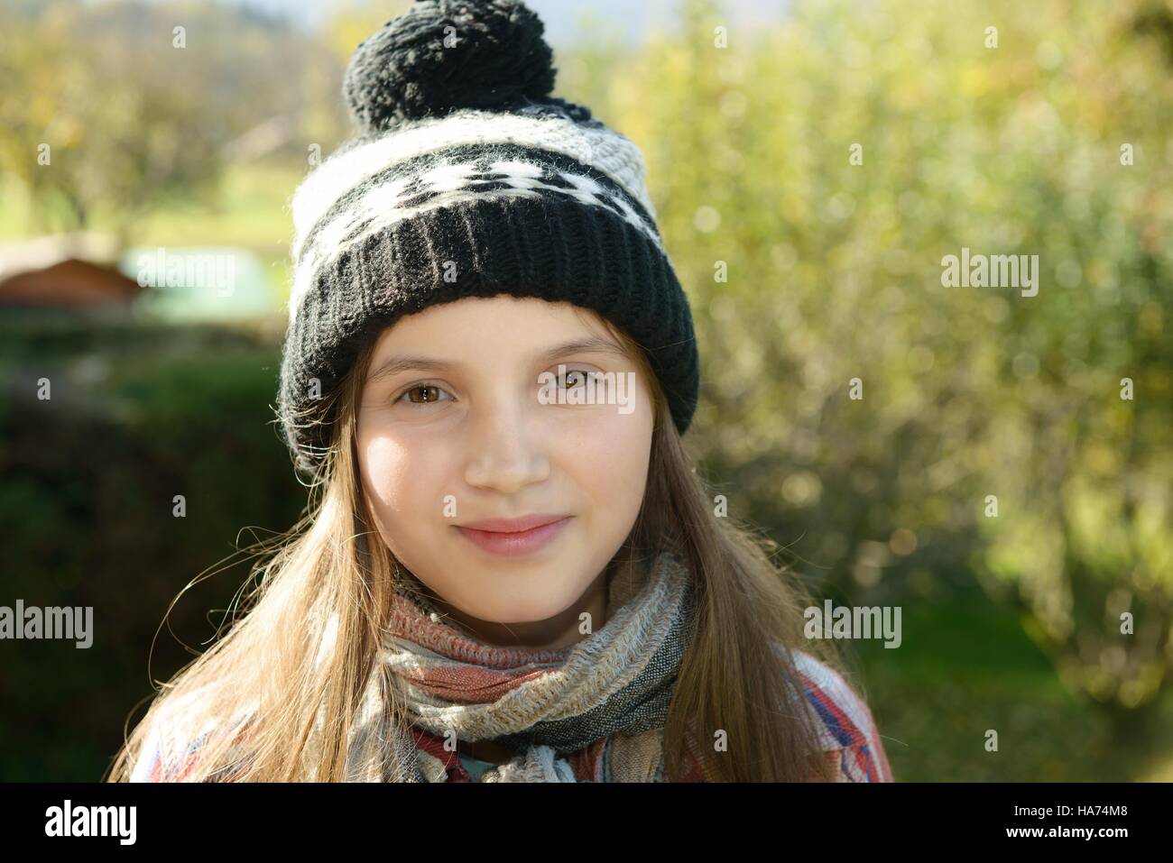 young pre teen girl with a winter cap, outdoors Stock Photo
