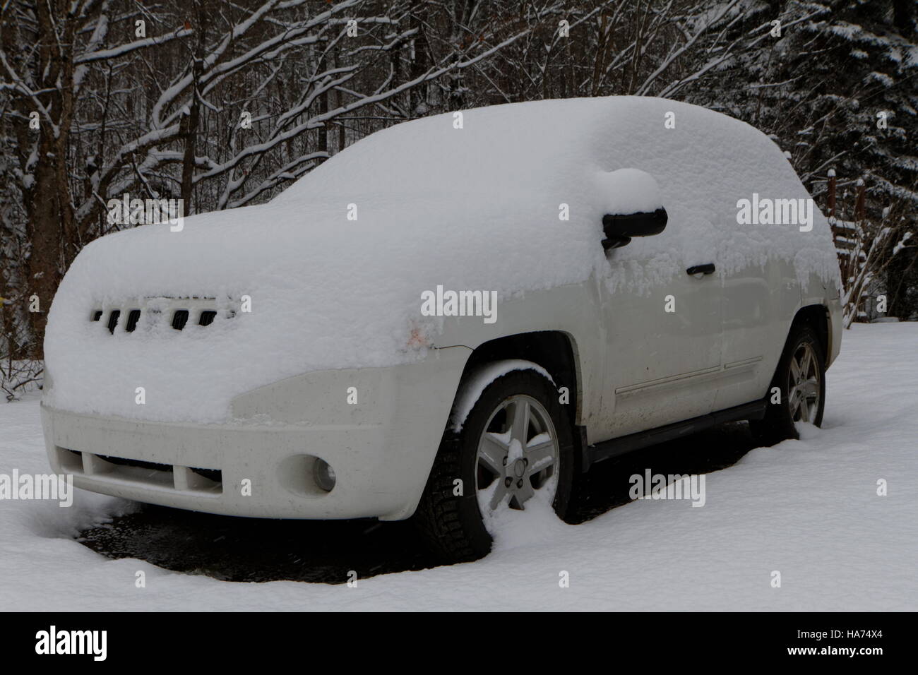 A snow covered Jeep Stock Photo