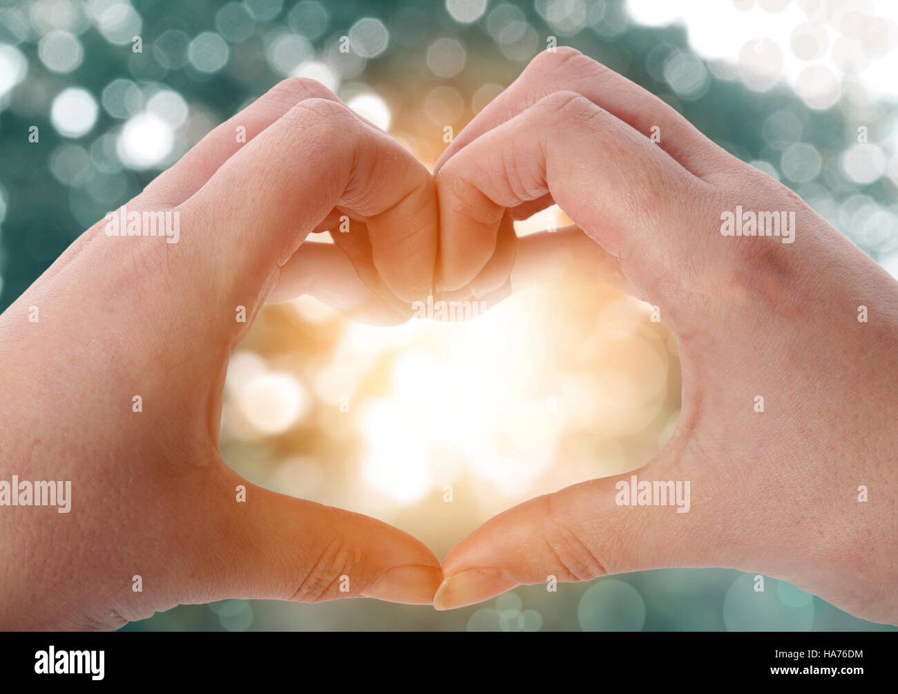 Fingers forming heart shape Stock Photo