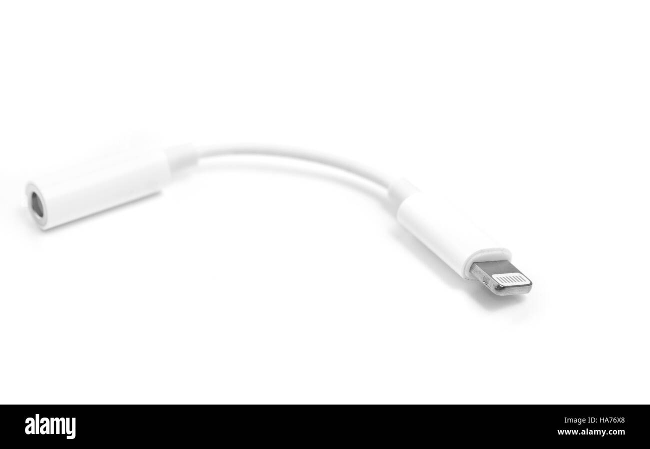 Lightning to jack 3.5mm headphone adapter isolated on white background. Digital accessory concept, designed for Apple Stock Photo