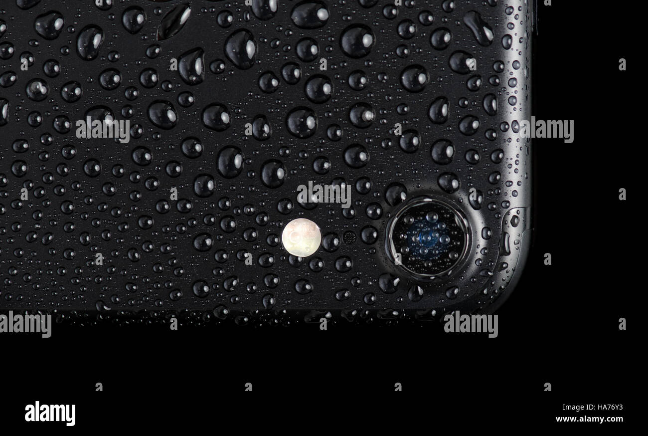 BRASOV, ROMANIA - 25 November 2016: iPhone 7 black matte with waterdrops, isolated on white Stock Photo