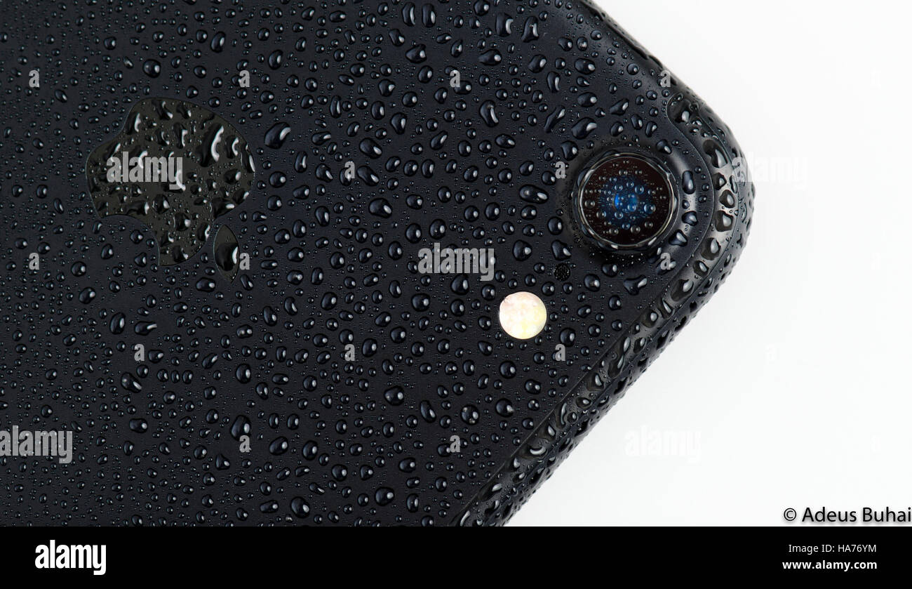 BRASOV, ROMANIA - 25 November 2016: iPhone 7 black matte with waterdrops on back and camera, isolated on white Stock Photo