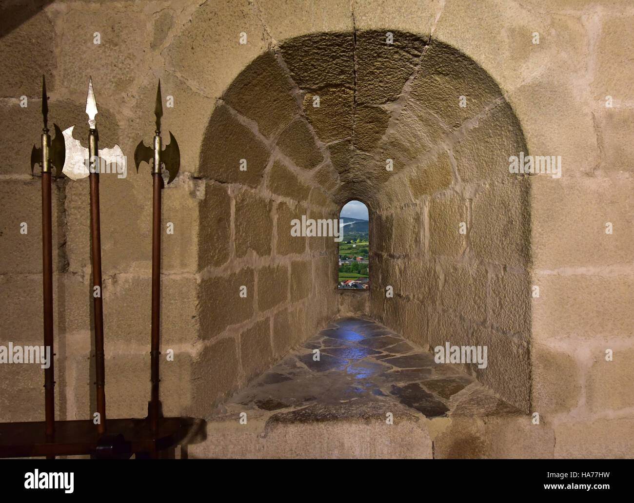 Arrow slit in Spanish castle. Stock Photo