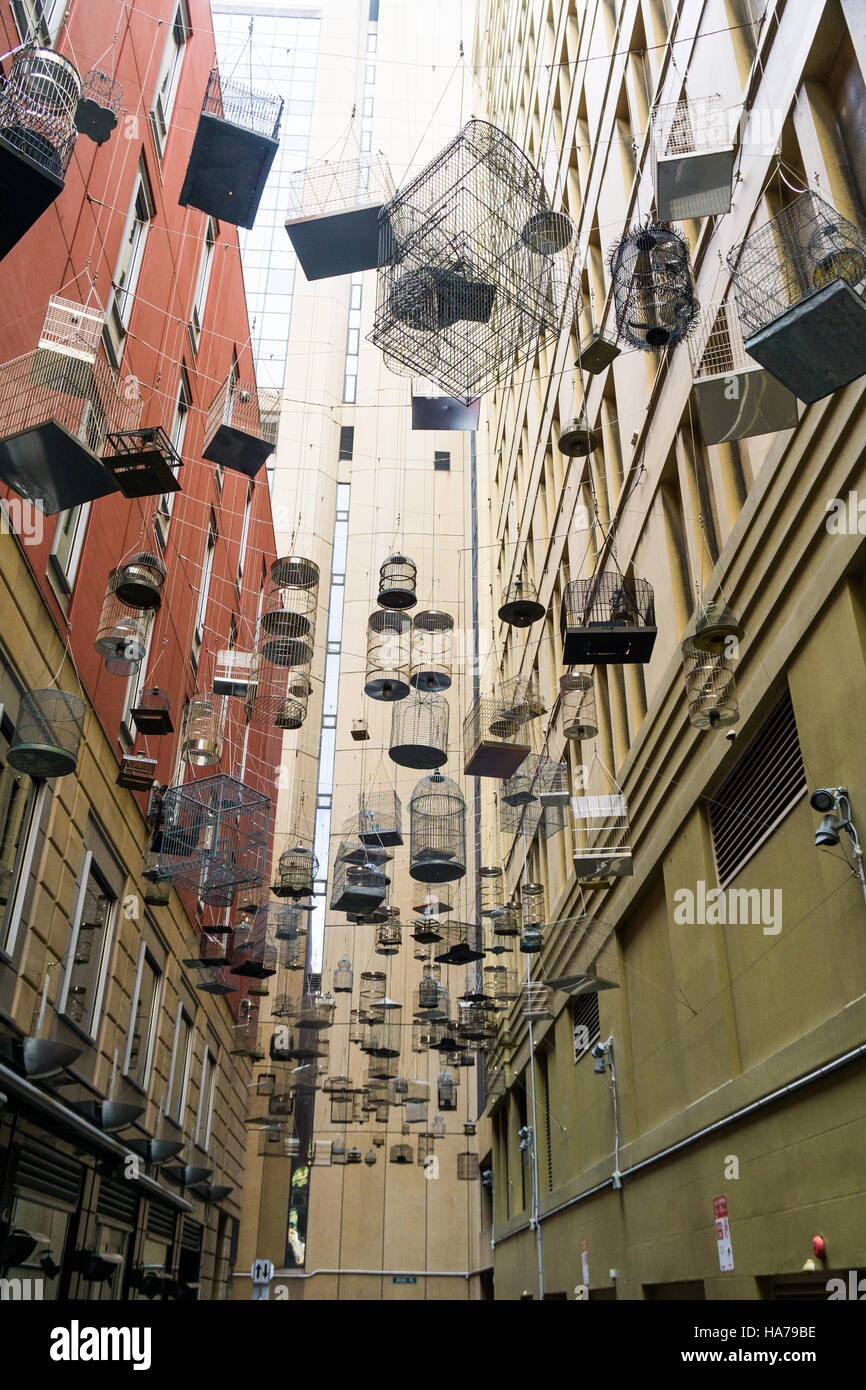 Hanging empty birdcages in Angel Place, Sydney an art installation