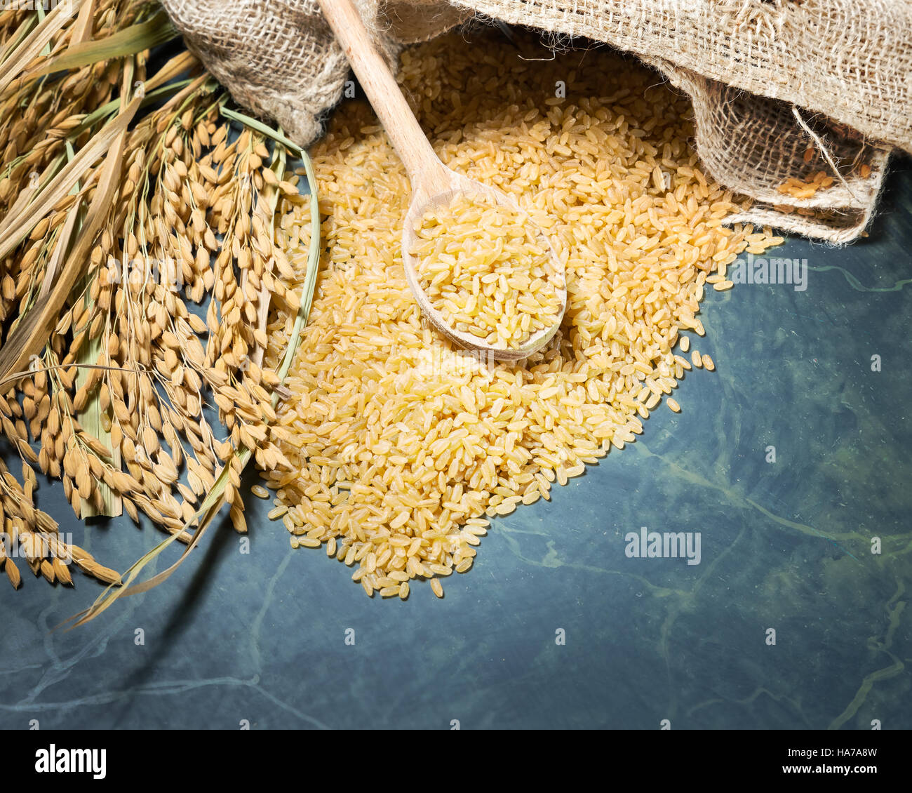 Embroils Rice Brown rice uncooked in a bag with a pile of brown rice with over a full ...