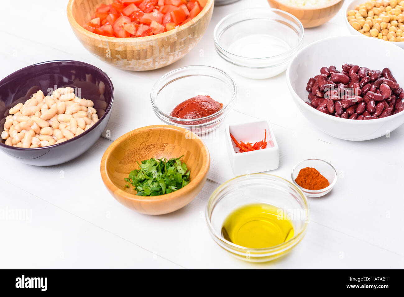Fresh Food Ingredients On White Wood Kitchen Table Stock Photo - Alamy