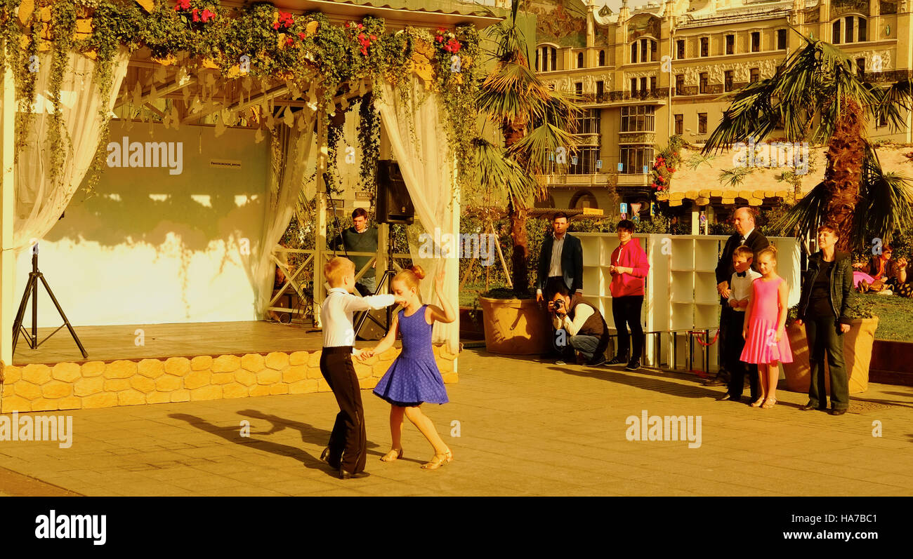 Elegantly dressed children dancing outdoors in Teatralnaya (Theatre) Square Moscow Russia Stock Photo