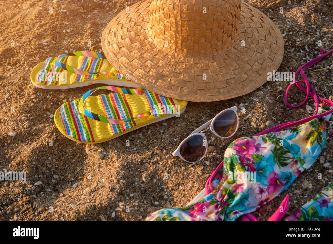 Beach hat and flip flops Stock Photo - Alamy