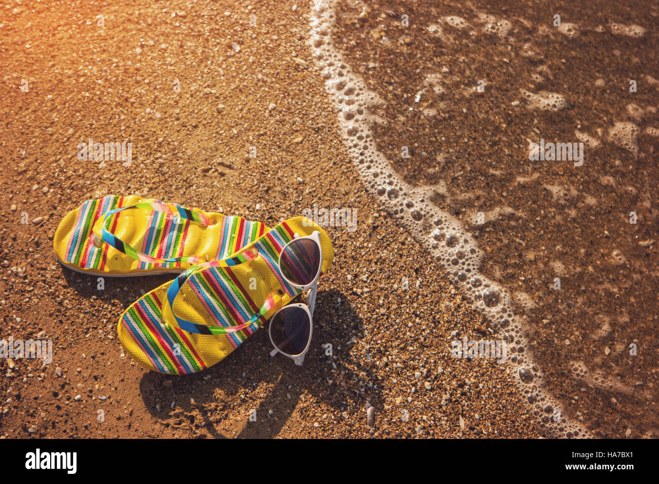 Flip flops with sunglasses Stock Photo - Alamy