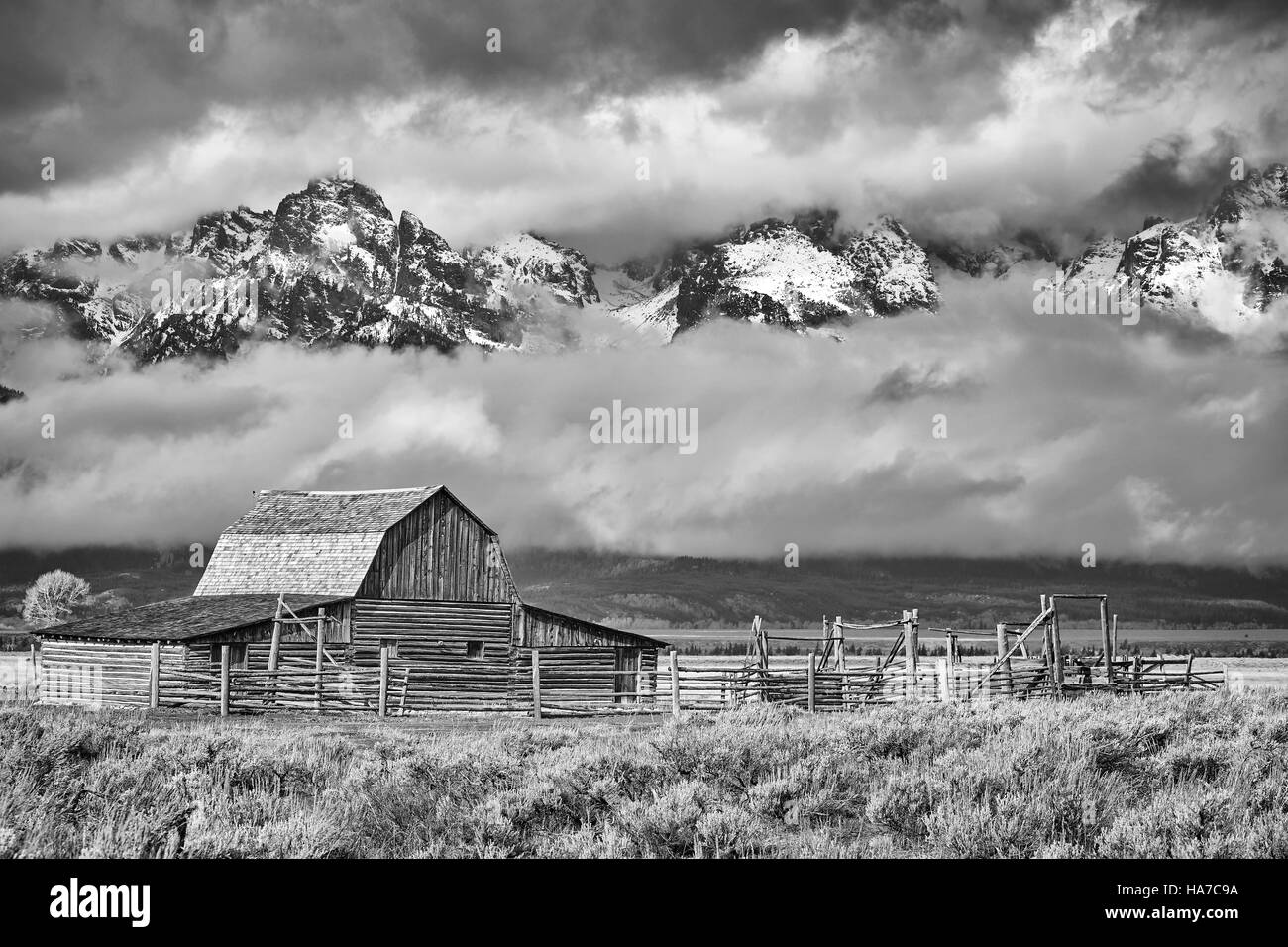 Black and white Teton mountain range with Moulton Barn in the Grand Teton National Park, Wyoming, USA. Stock Photo