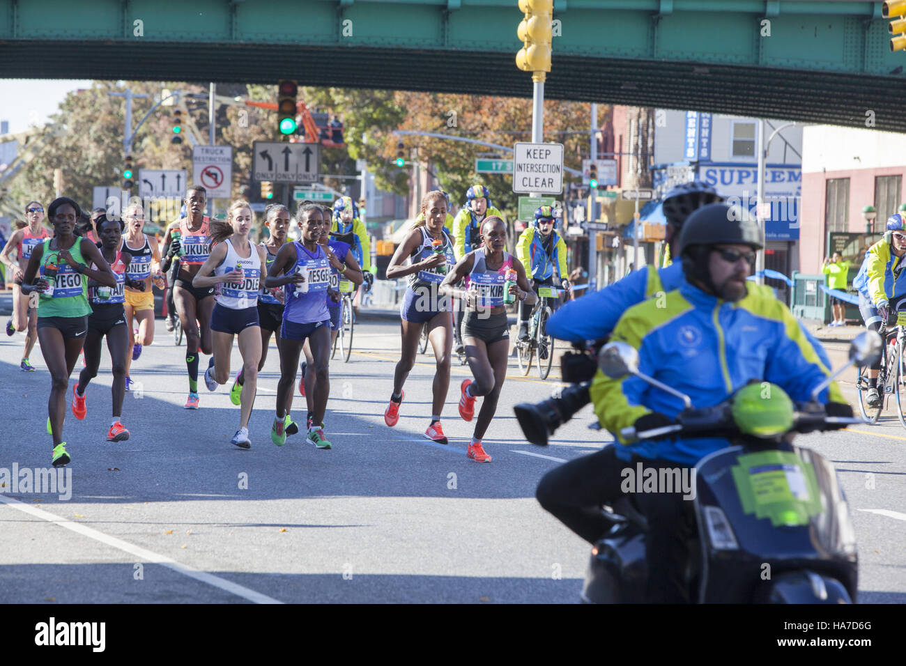 Front female runners along 4th Avenue in Brooklyn during the New York City Marathon. Stock Photo