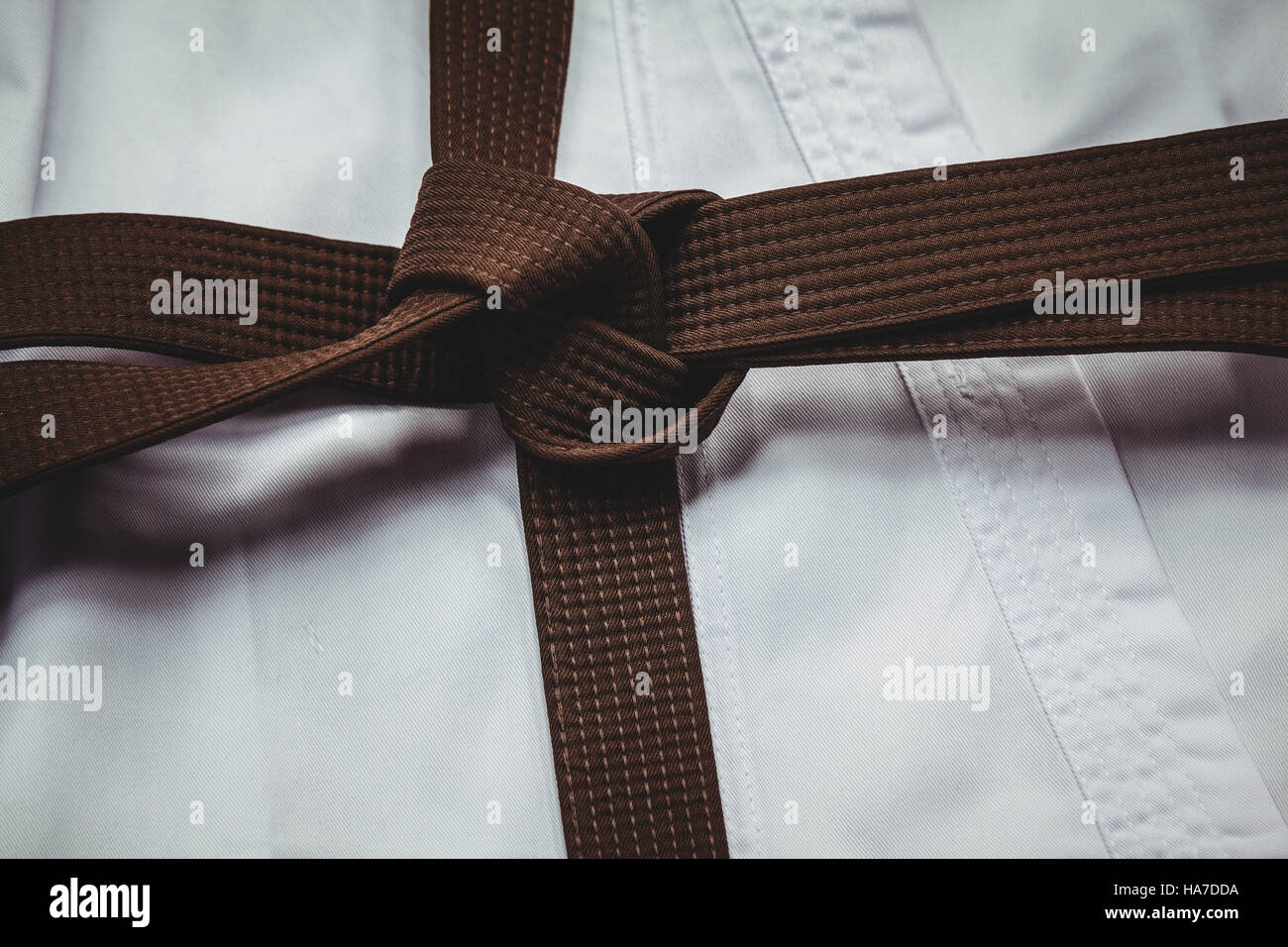 Karate uniform and brown belt Stock Photo - Alamy