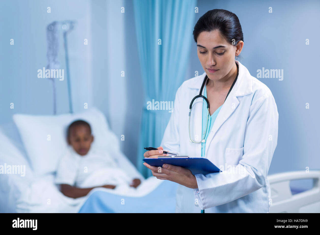 Boy talking female doctor hi-res stock photography and images - Alamy