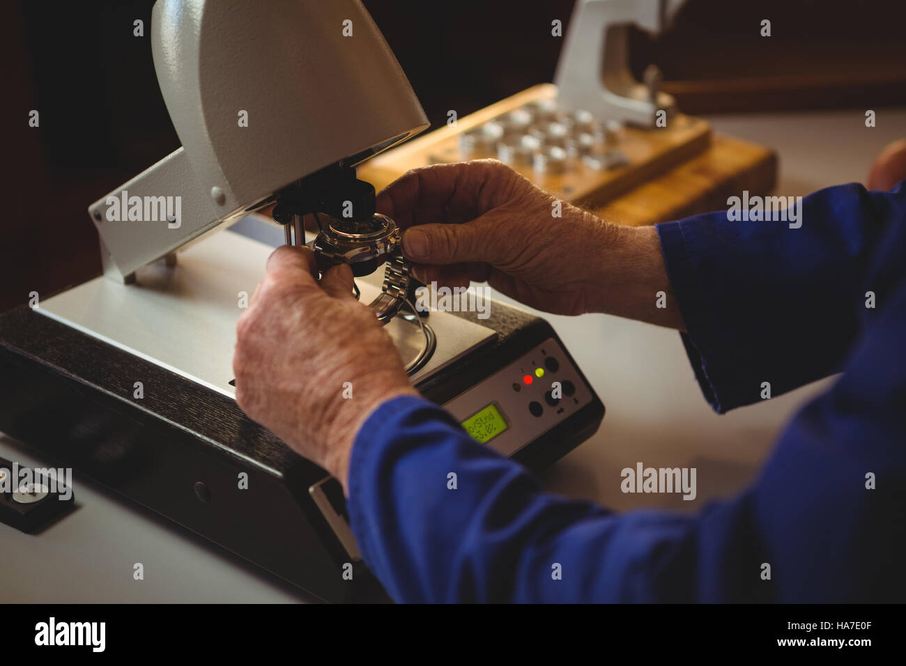 Hands of horologist repairing a watch Stock Photo
