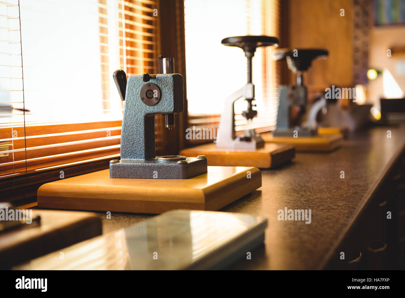 Watch placed on microscope for repair Stock Photo Alamy