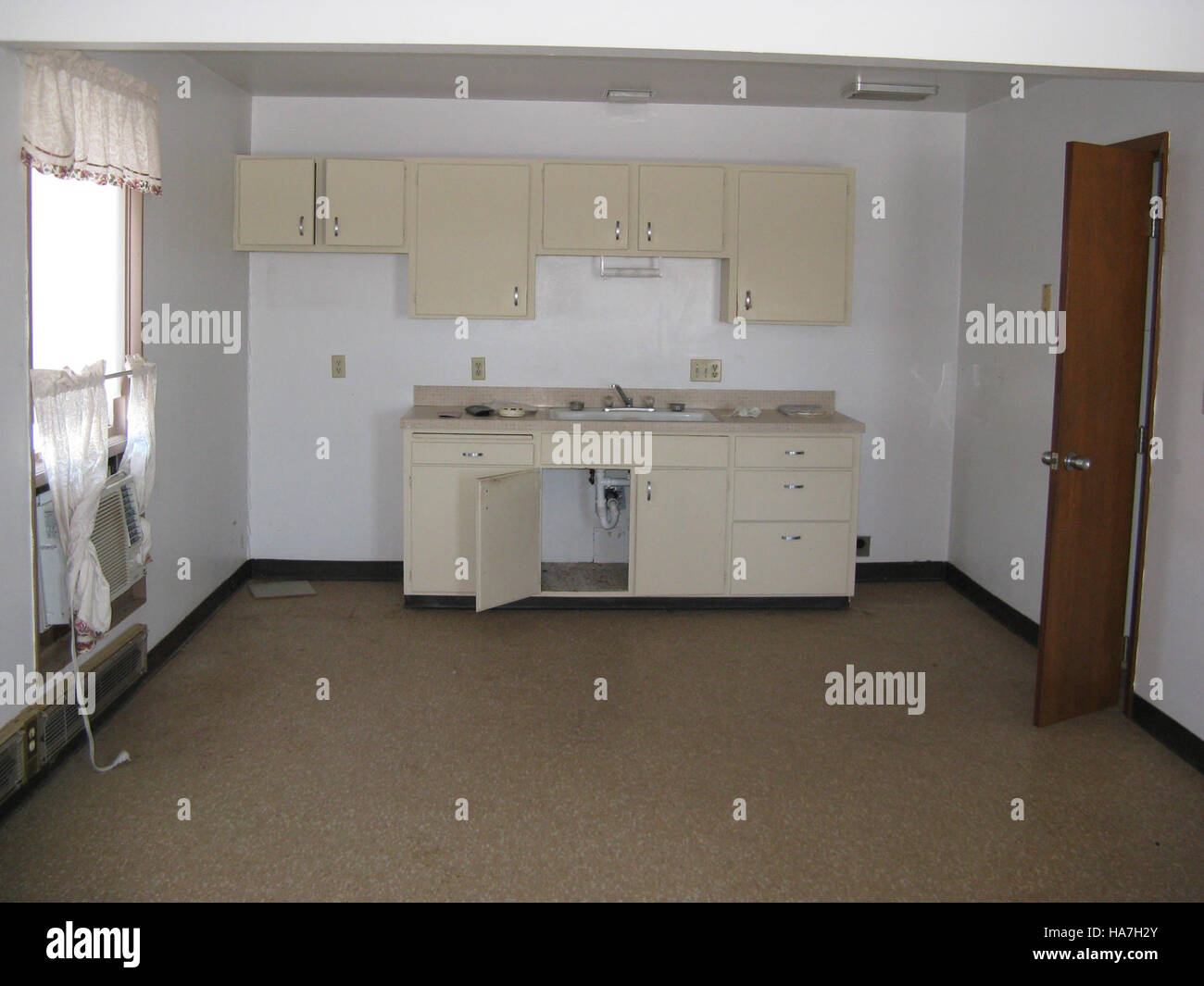 View of This image of a kitchen in Parkview Apartments showcases the living ...