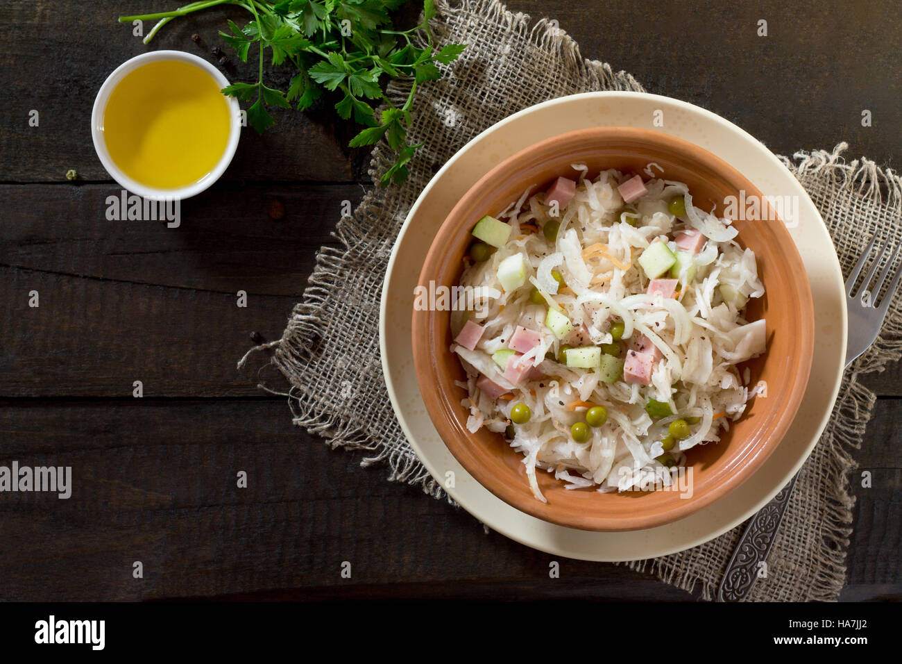 Salad with cabbage, chicken, apple, cucumber and walnuts. Healthy food concept. Top view. Stock Photo