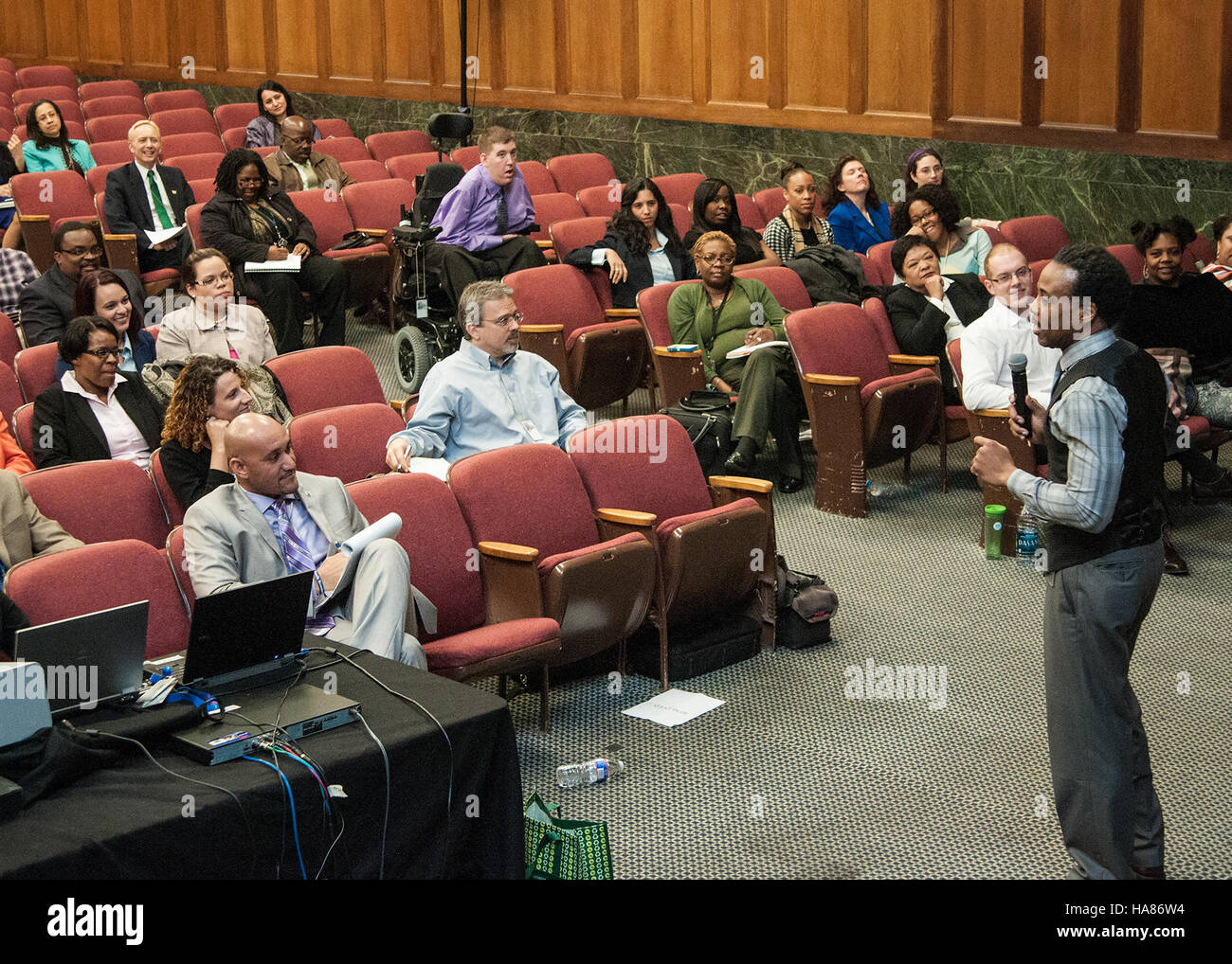 This image shows a meeting on civil rights compliance and diversity ...