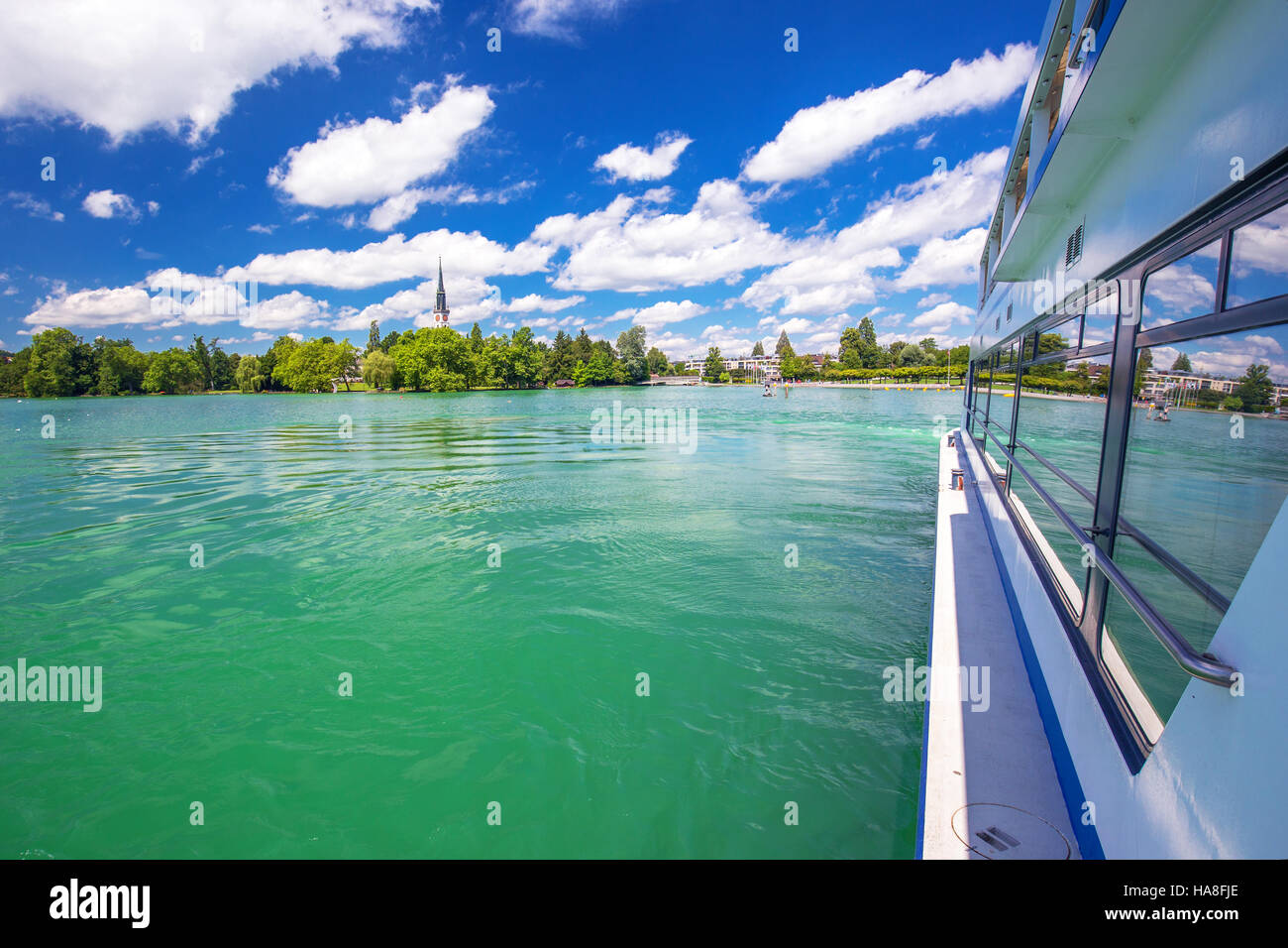 Beautiful Swiss landscape view from famous boat at Lake Zug on a sunny day with blue sky and clouds in summer, Canton of Zug, Switzerland Stock Photo