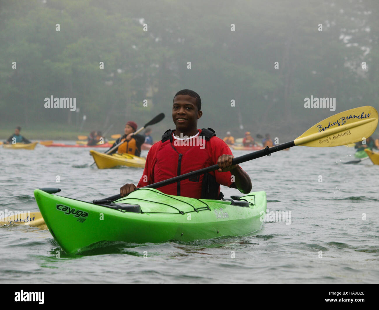 Tajaun Levy participating in the annual CIP kayaking trip at Rachel Carson National Wildlife Refuge, promoting environmental awareness and conservation efforts. Stock Photo