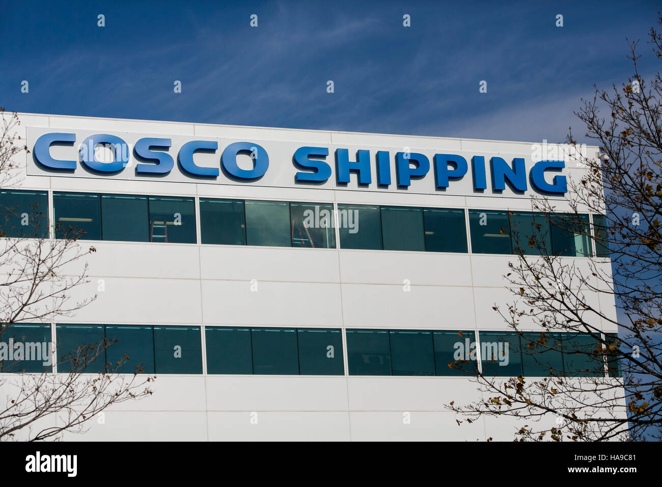A logo sign outside of a facility occupied by the China Ocean Shipping Company (COSCO) in Secaucus, New Jersey on November 5, 2016. Stock Photo