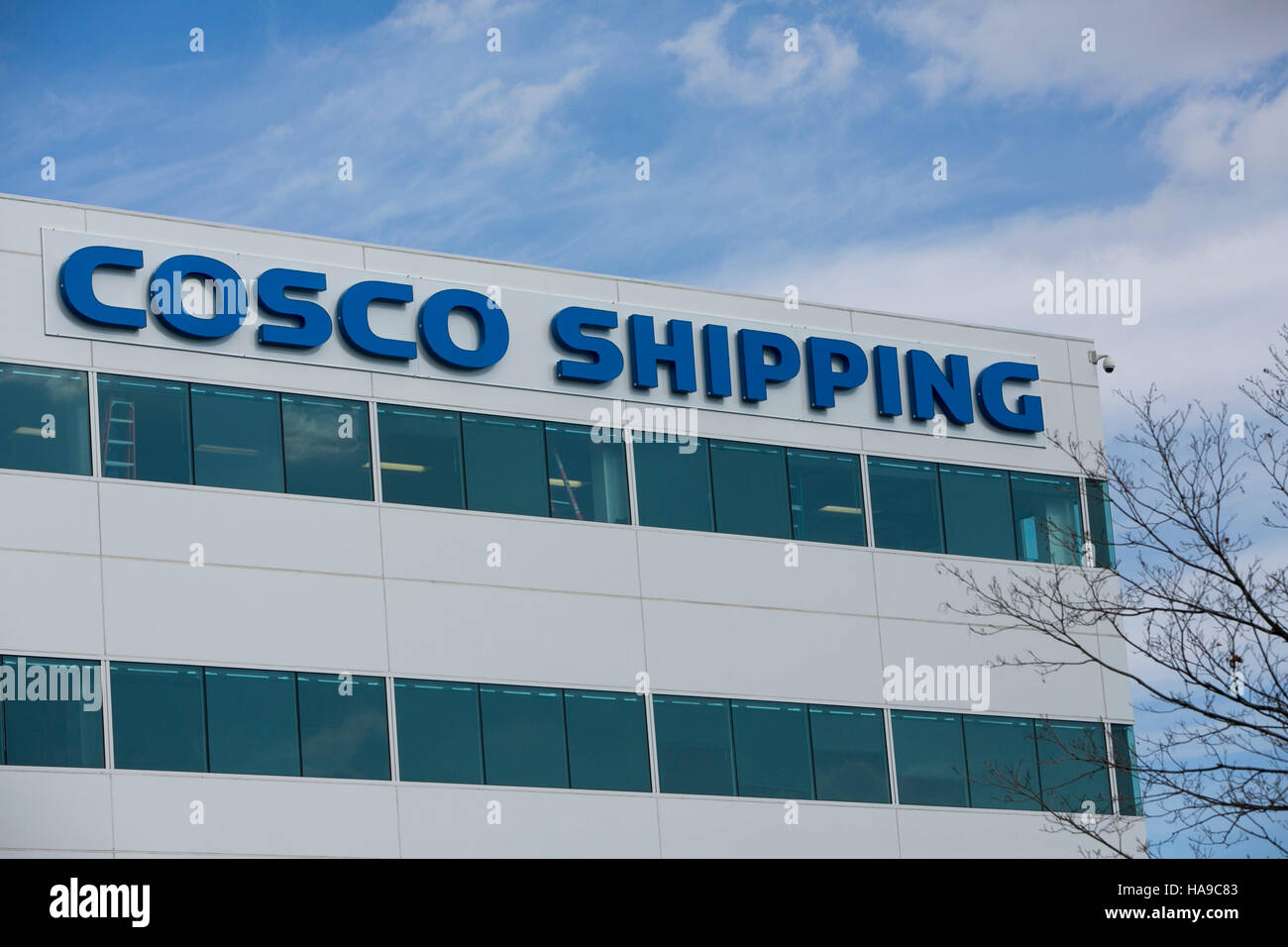 A logo sign outside of a facility occupied by the China Ocean Shipping Company (COSCO) in Secaucus, New Jersey on November 5, 2016. Stock Photo