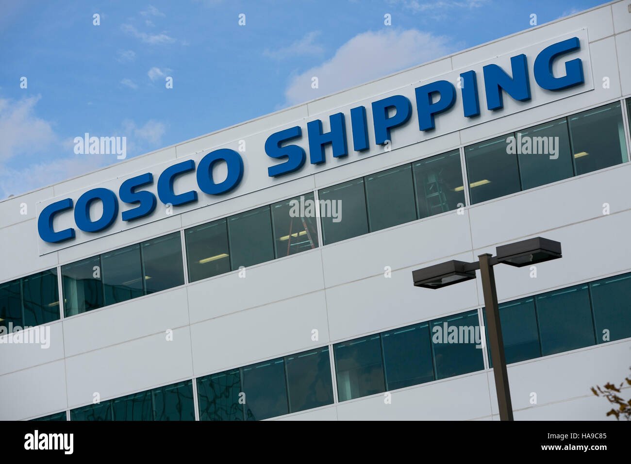 A logo sign outside of a facility occupied by the China Ocean Shipping Company (COSCO) in Secaucus, New Jersey on November 5, 2016. Stock Photo