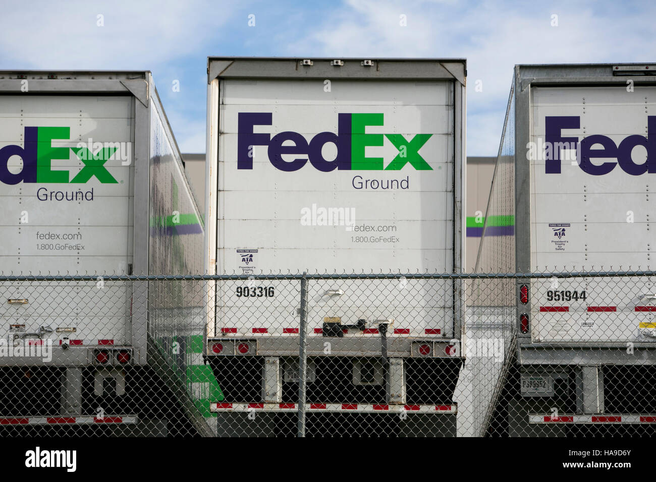 FedEx Ground logos on truck trailers lined up at a facility in Dayton