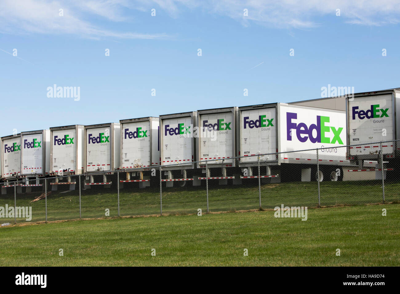 FedEx Ground logos on truck trailers lined up at a facility in Dayton