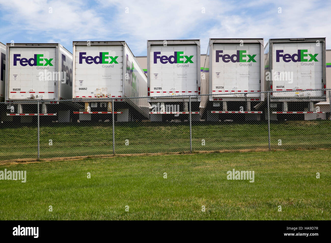 FedEx Ground logos on truck trailers lined up at a facility in Dayton