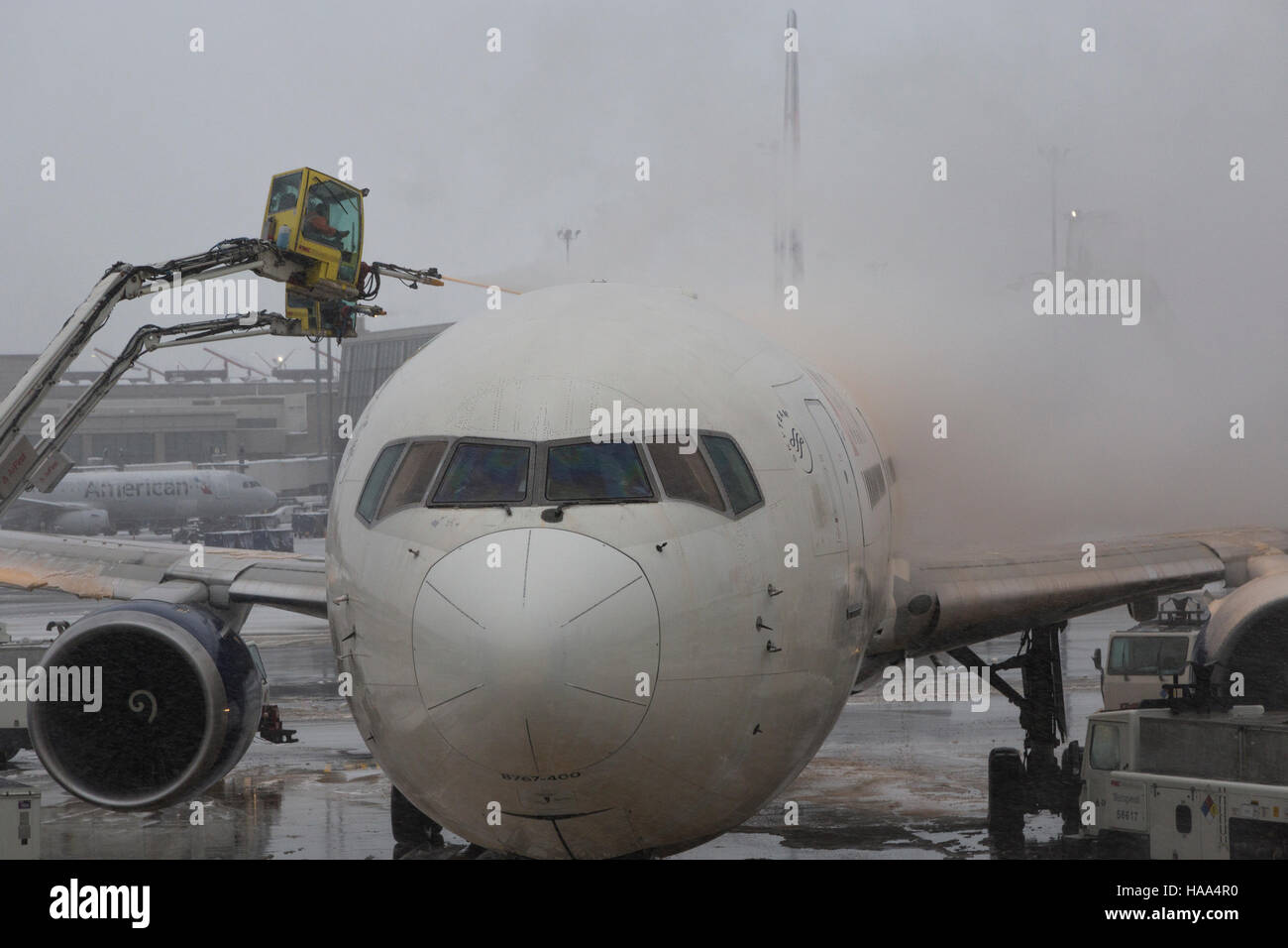 Delta Airlines airplane being de-iced in Boston Logan Airport Stock Photo