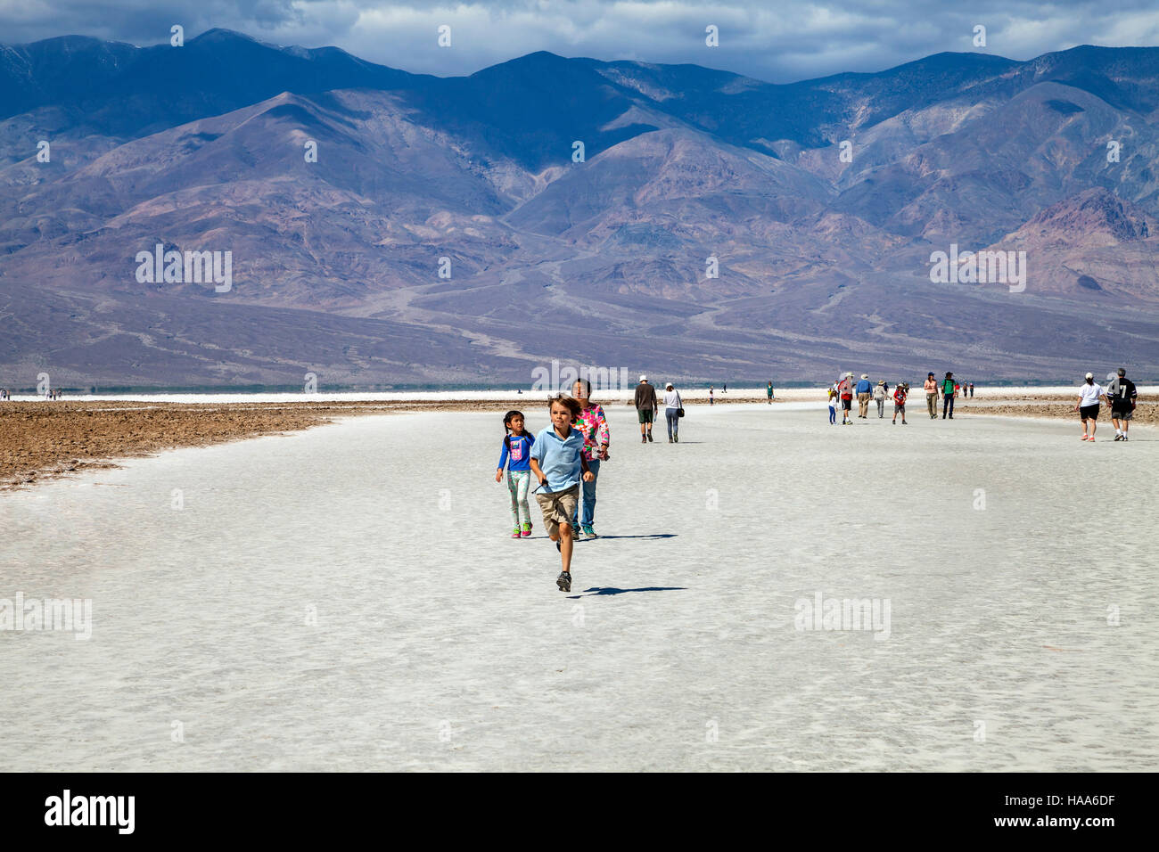 Boy running in the salt basin, Badwater Basin, Death Valley National Park, California, USA Stock Photo