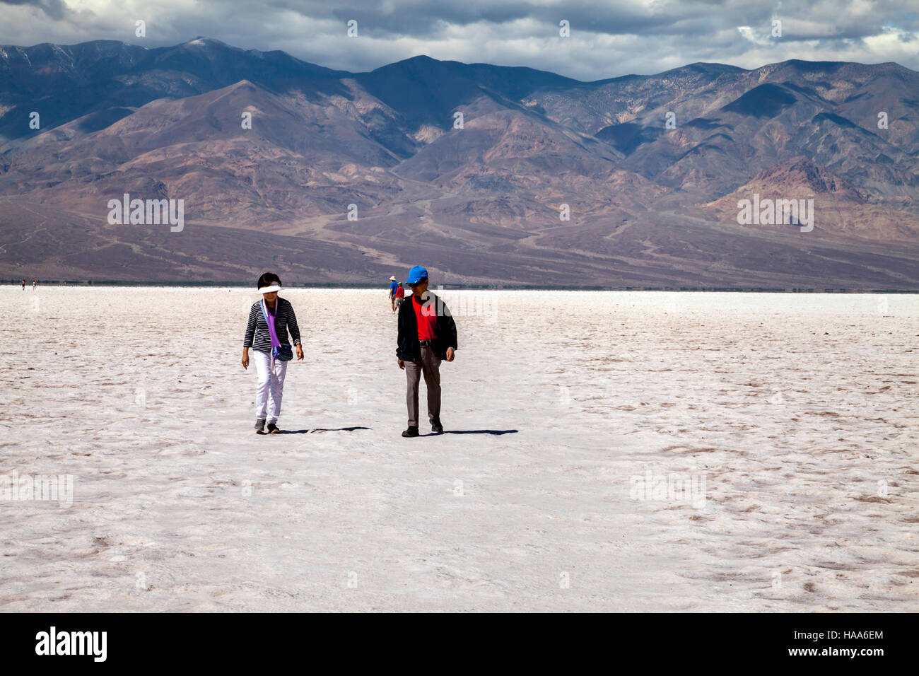 Asian tourists visiting Badwater Basin, Death Valley National Park, California, USA Stock Photo