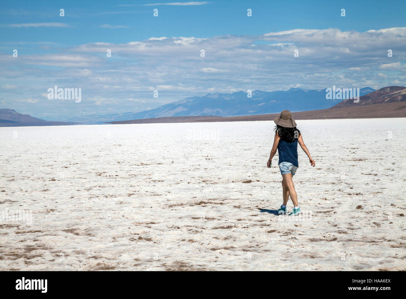 Woman walking in the middle of the Badwater Basin, Death Valley ...