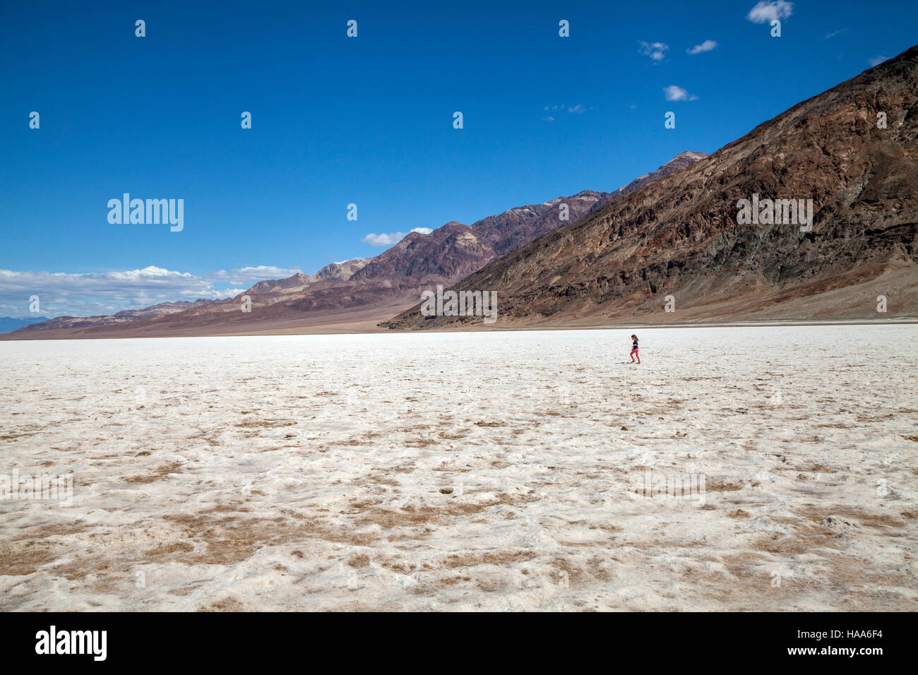 Young girl walking in the middle of the Badwater Basin, Death Valley National Park, California, USA Stock Photo