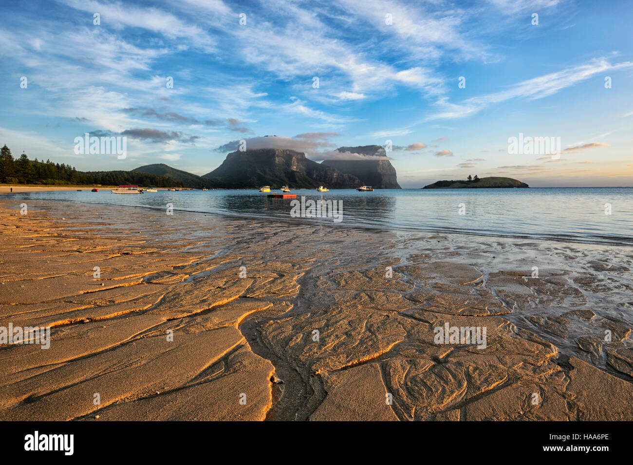 Sunset over the Lagoon at low tide, Lord Howe Island, NSW, Australia, with Mt Gower and Mt Lidgbird in the distance Stock Photo