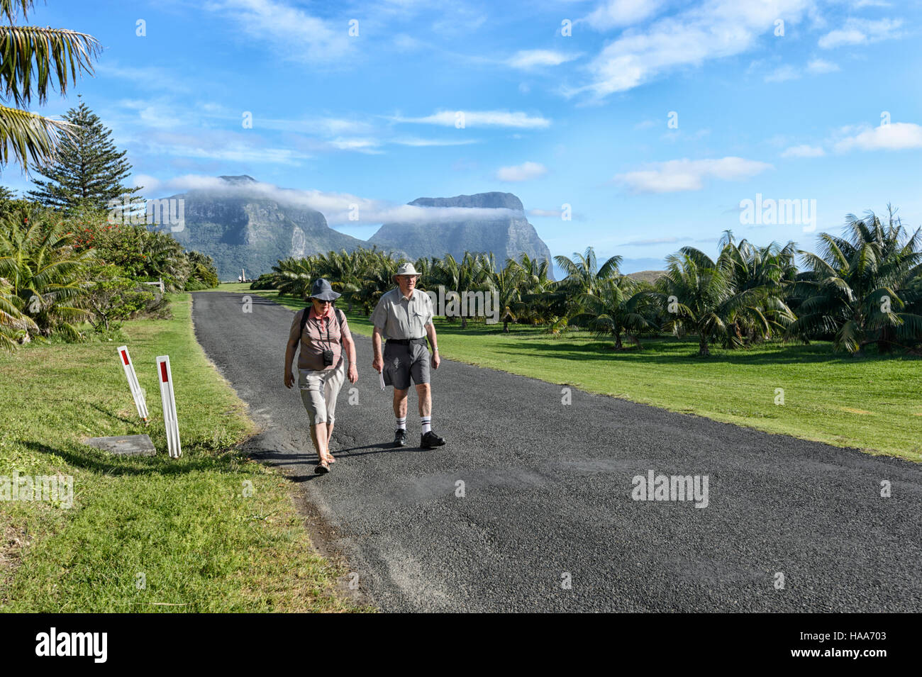 Senior Couple strolling on mainly pedestrian Lord Howe Island, New South Wales, NSW, Australia Stock Photo