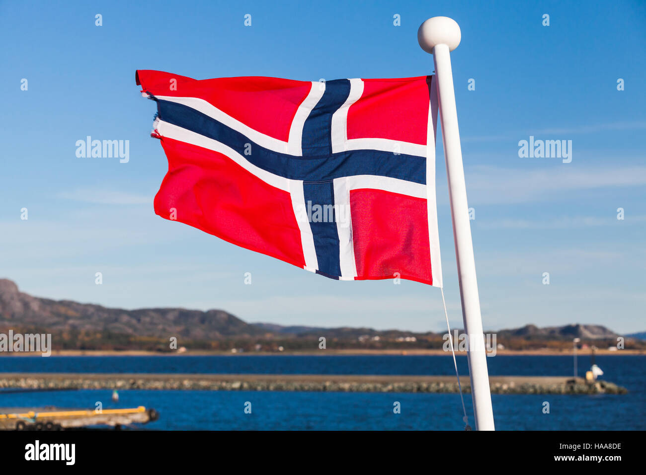 Flag of Norway waving over blue sky background Stock Photo - Alamy