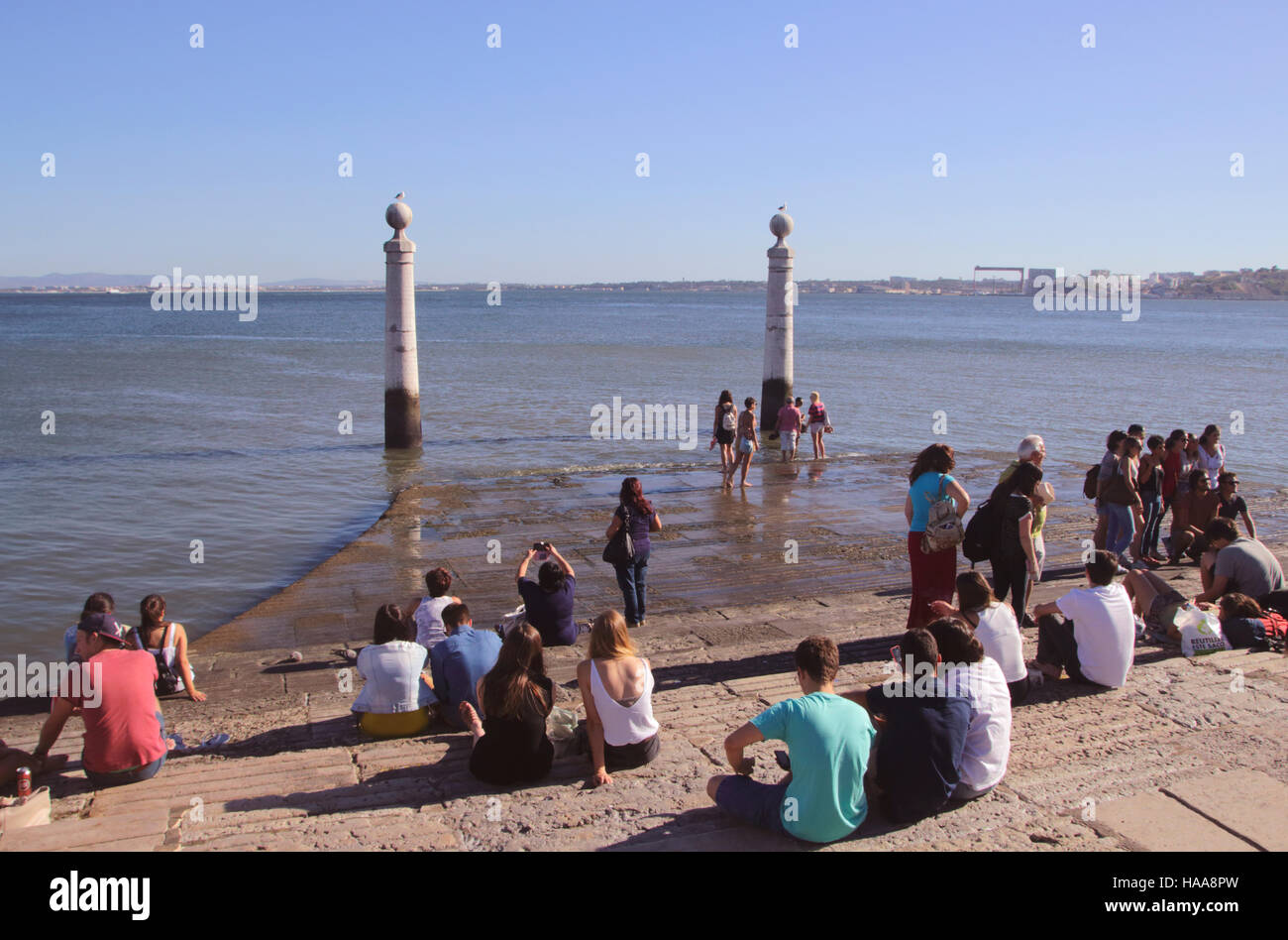 People relaxing at Cais Das Colunas near Praca do Comercio by River Tagus Lisbon Portugal Stock Photo
